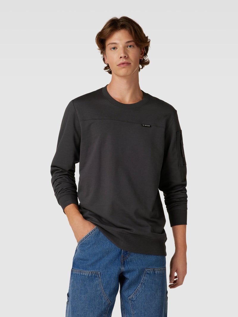 Sweatshirt mit Reißverschlusstasche am Ärmel in anthrazit