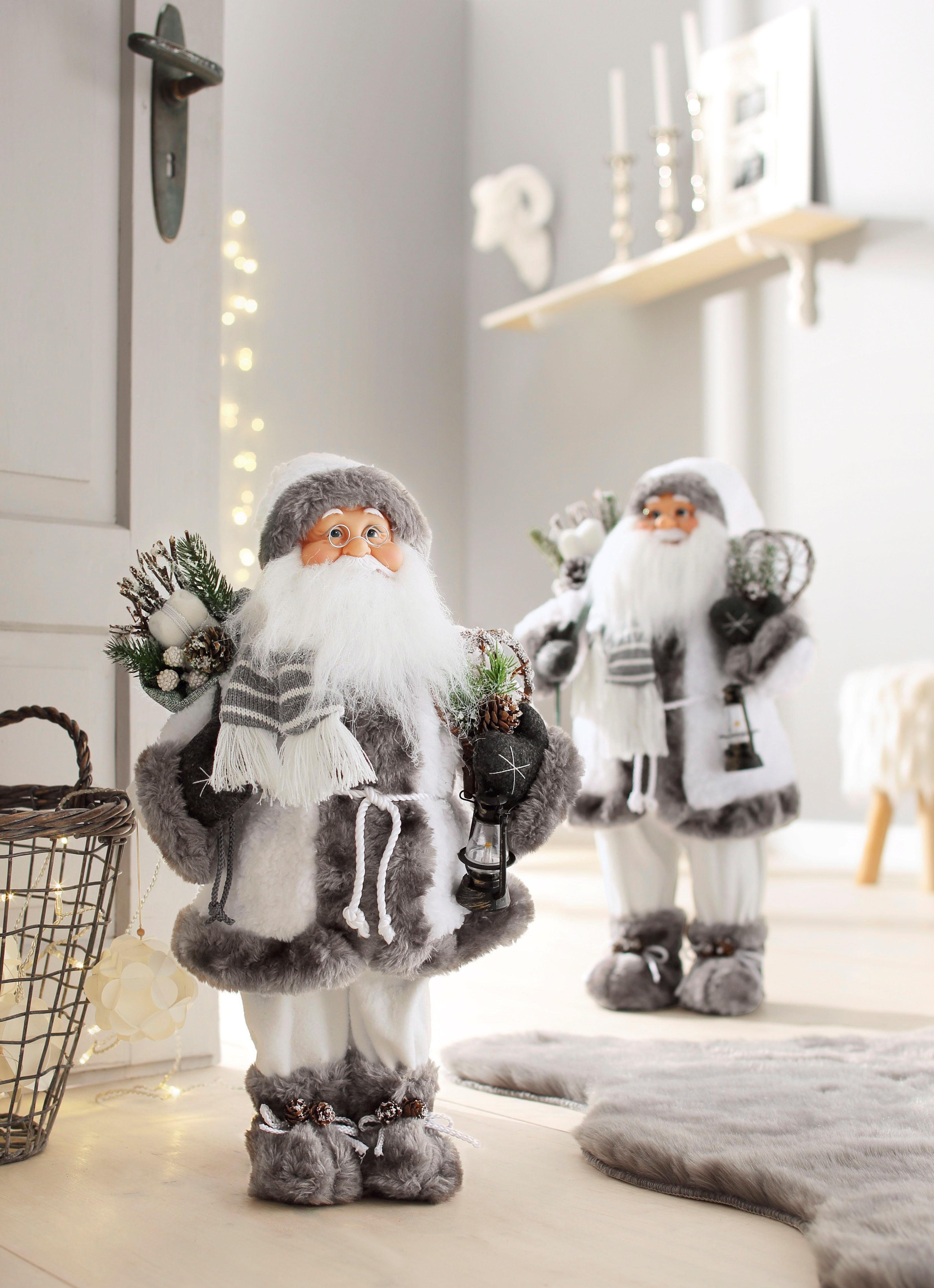 HOSSNER - HOMECOLLECTION Weihnachtsmann Santa mit weißem Mantel und Laterne, Weihnachtsdeko