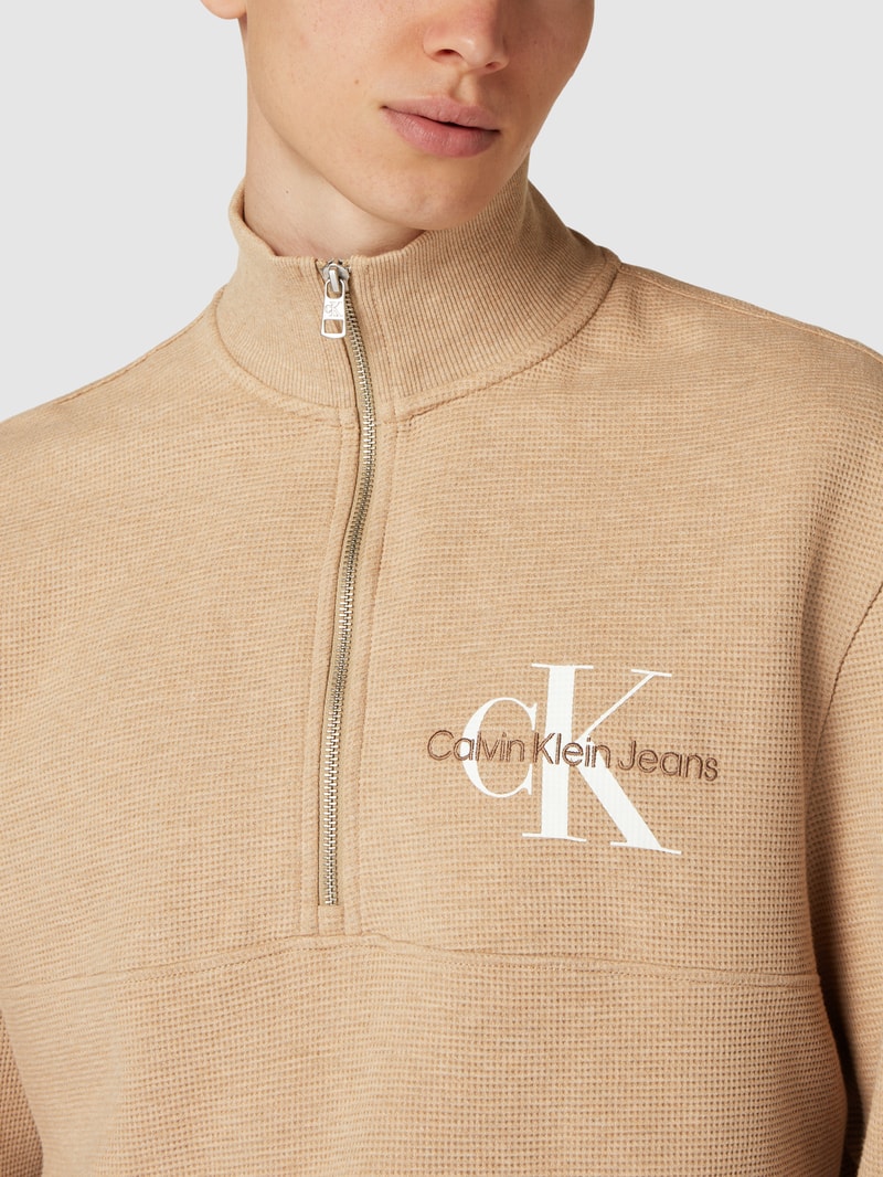 Strickpullover mit Label-Details in beige meliert