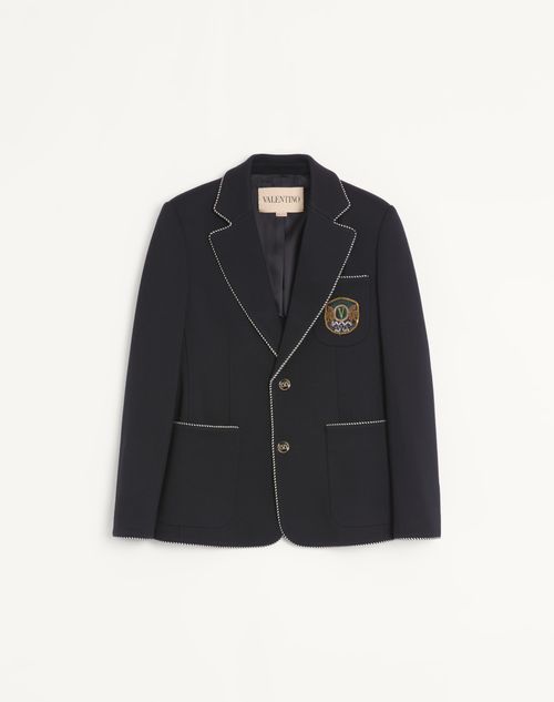 Valentino wollen jas met enkele rij knopen en Valentino-patch