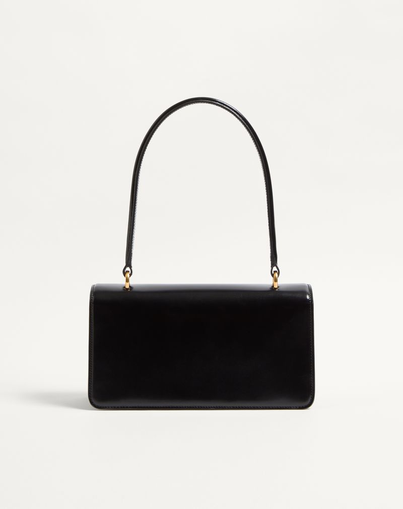 Bolsa Valentino Garavani Vain em couro de bezerro brilhante com alça.