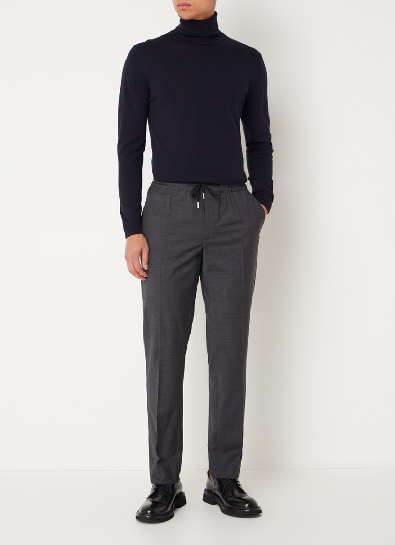 Pantaloni chino Sandro din amestec de lână, cu croială mulată și buzunare laterale.