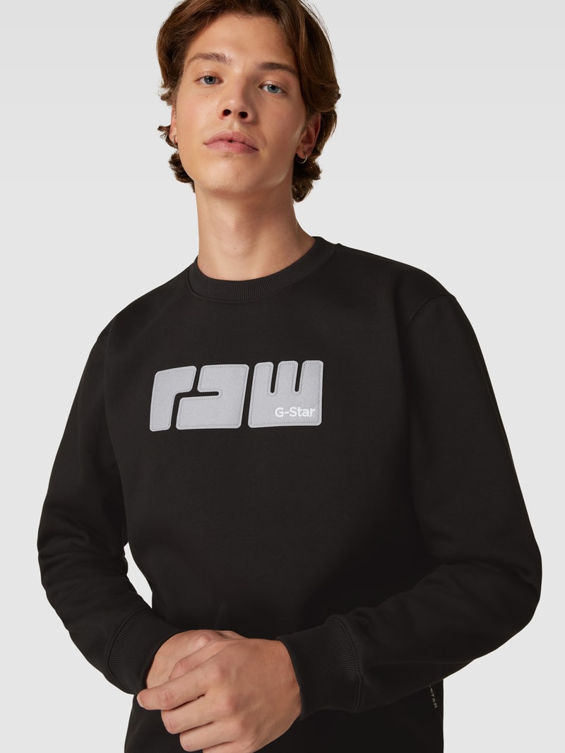Sweatshirt mit Label-Stitching Modell 'RAW.' in schwarz