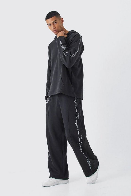 Oversize Trainingsanzug mit rohem Saum und Stickerei