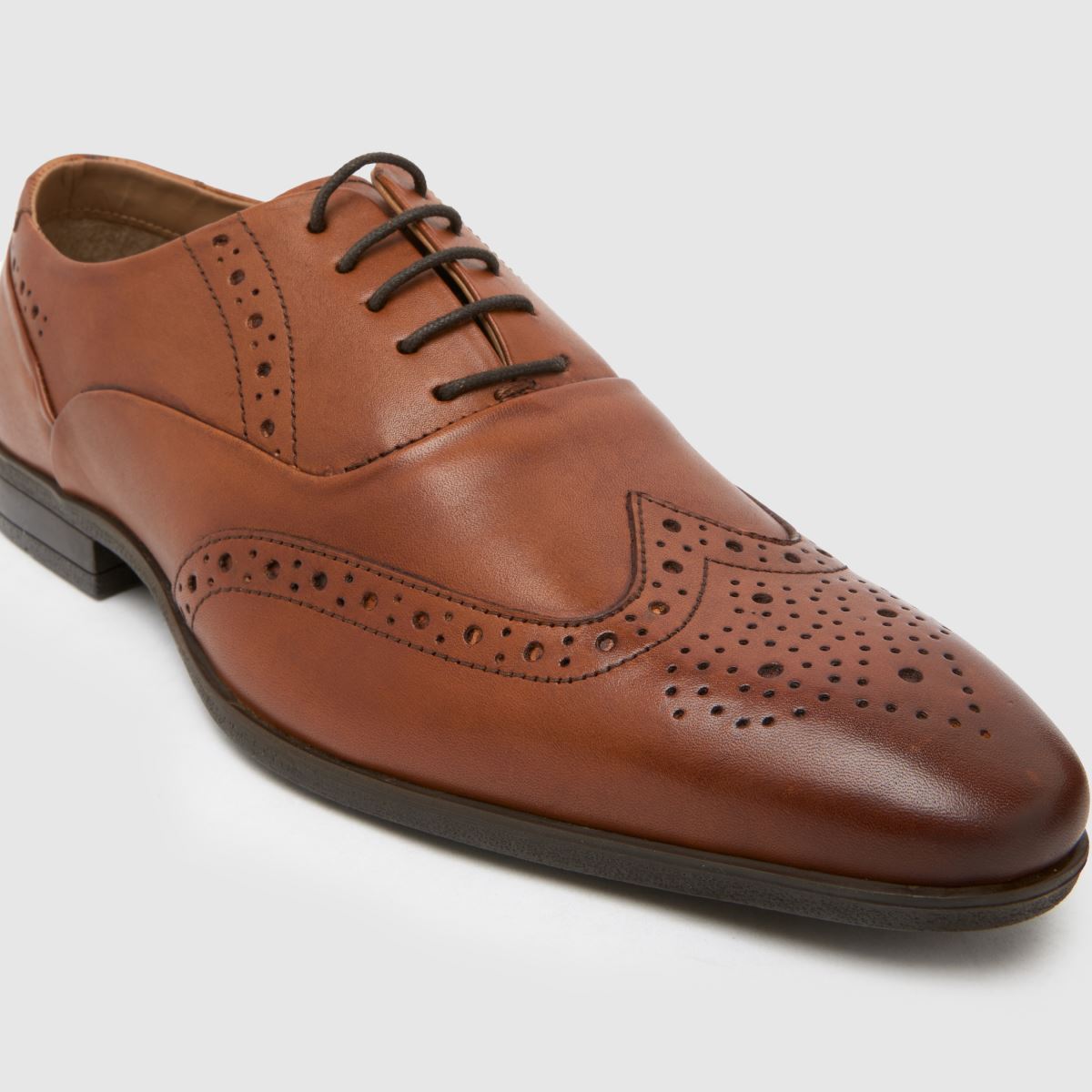 Schuh Row – Bruna brogueskor i läder med dragkedja