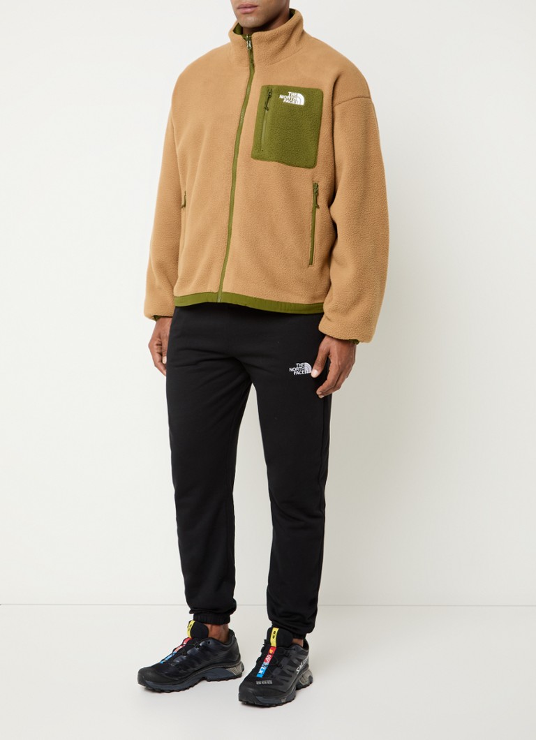 Reverzibilna jakna The North Face Yumiori s džepovima na patentni zatvarač i vezom logotipa