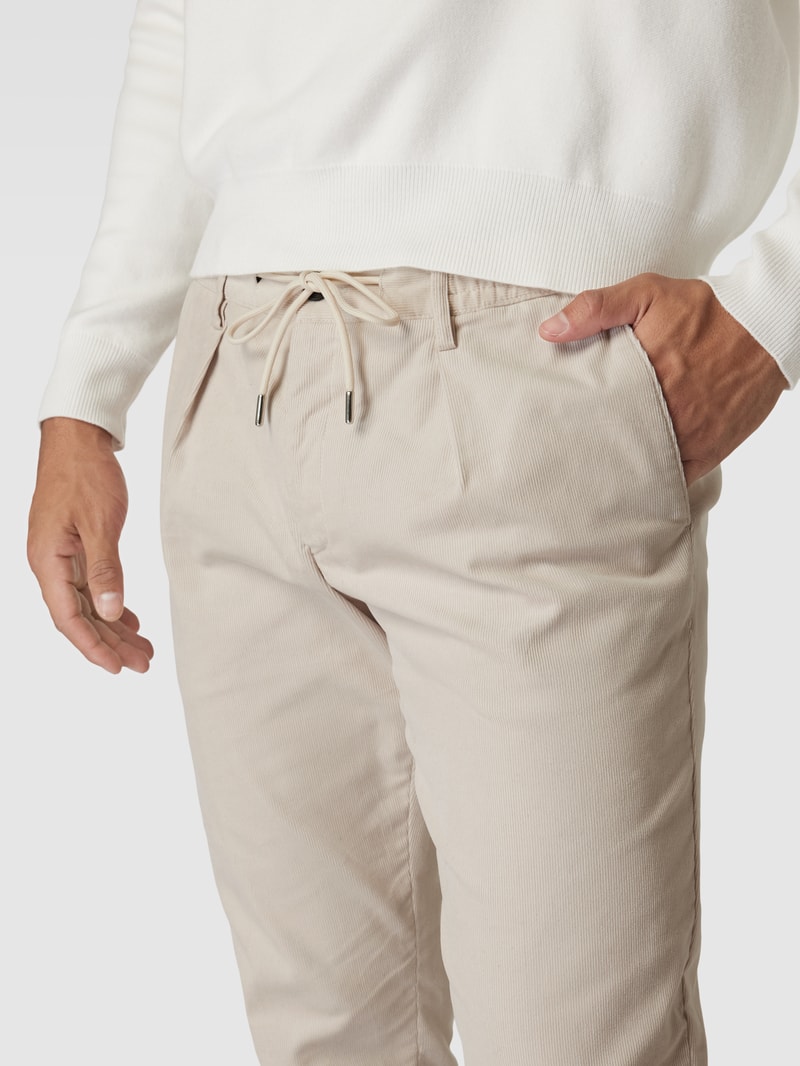 Chino mit Paspeltaschen in beige