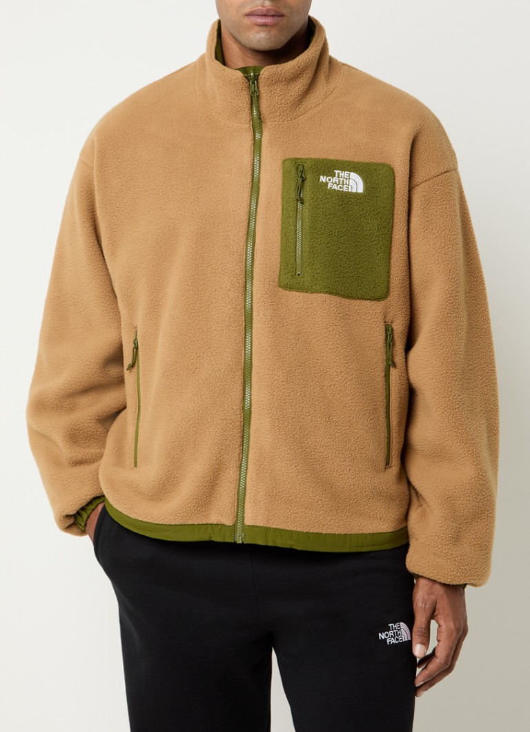 Reverzibilna jakna The North Face Yumiori s džepovima na patentni zatvarač i vezom logotipa