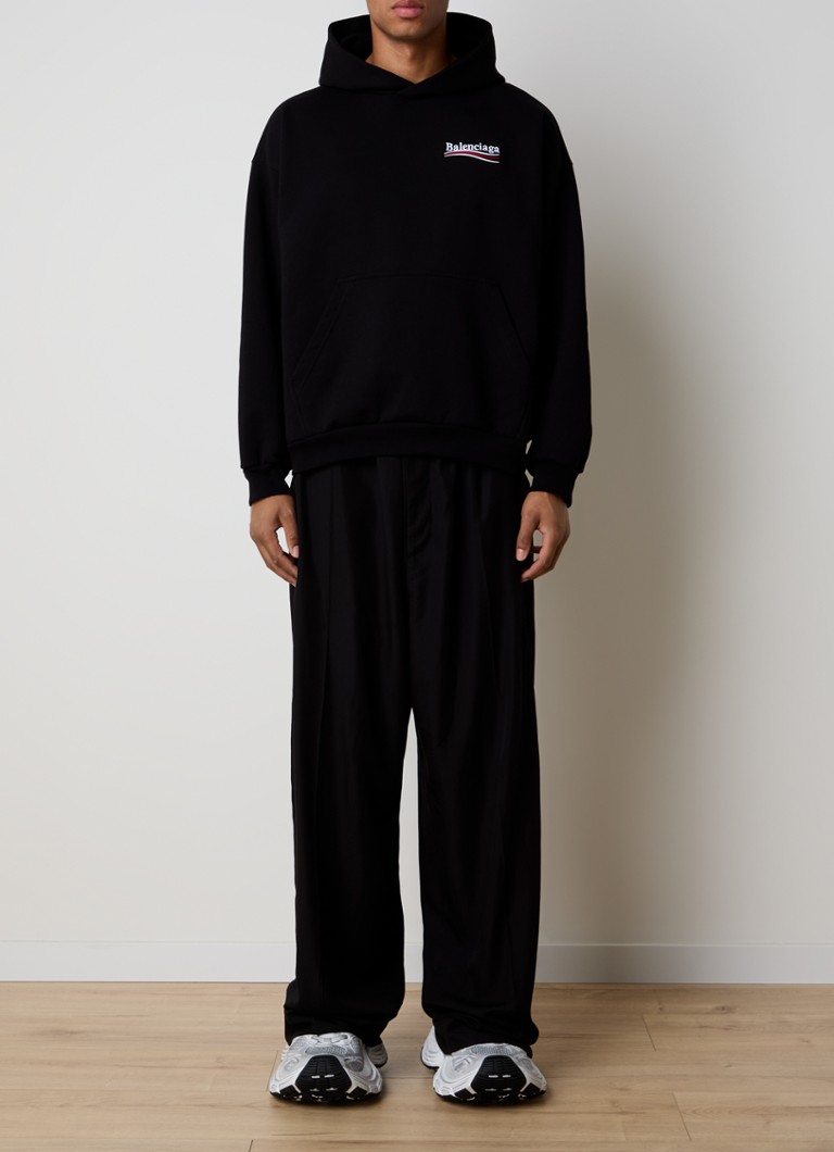 Felpa con cappuccio oversize Balenciaga con logo e stampa sul retro.