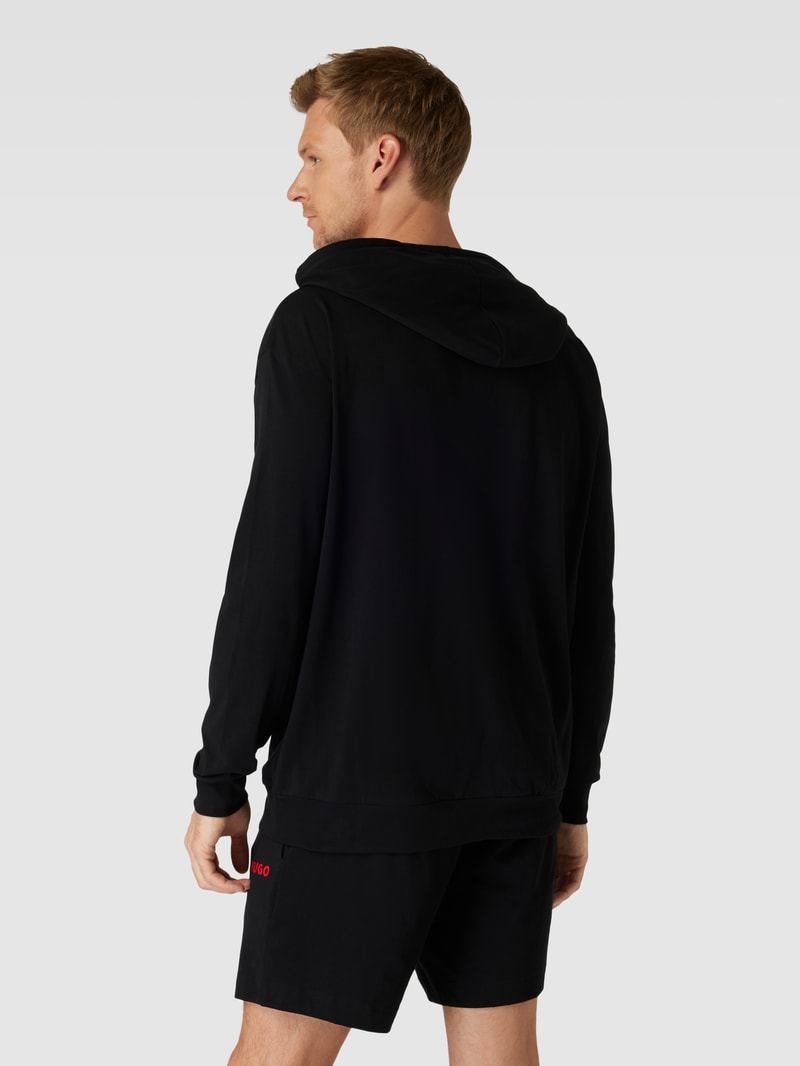 Hoodie in unifarbenem Design mit Känguru-Tasche in schwarz