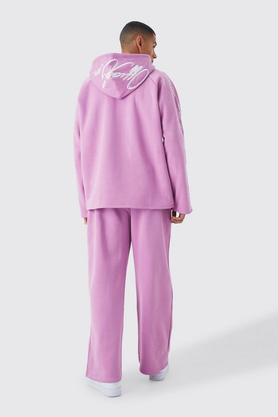 Oversize Trainingsanzug mit rohem Saum und Stickerei