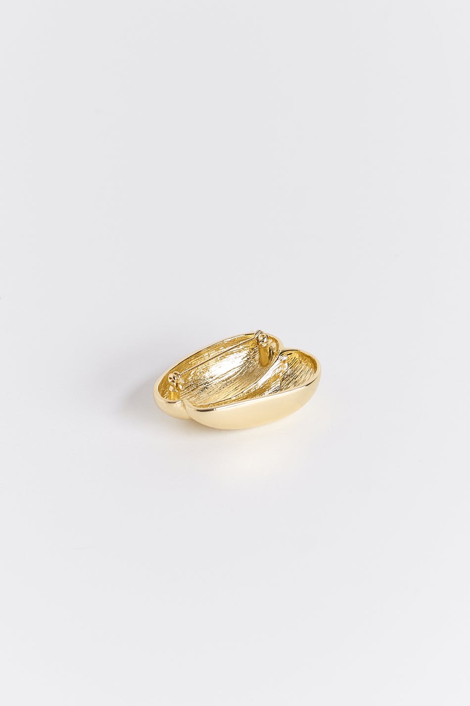 Uneven brooch