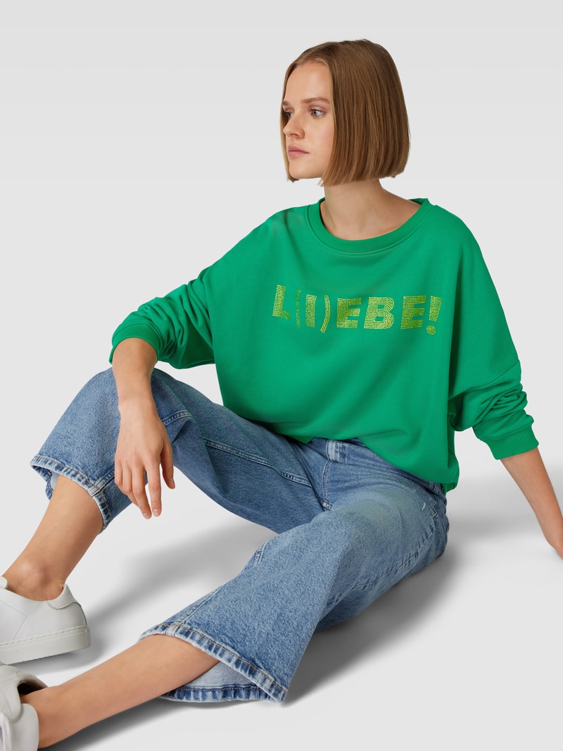 Sweatshirt mit Statement-Print Modell 'L(I)EBE!' in grün