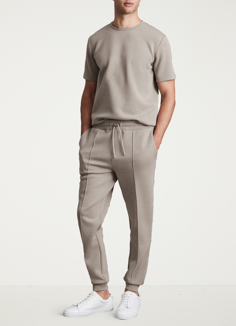 Pantaloni de trening slim fit de la Reiss Premier, cu șnur de fixare și buzunare laterale.