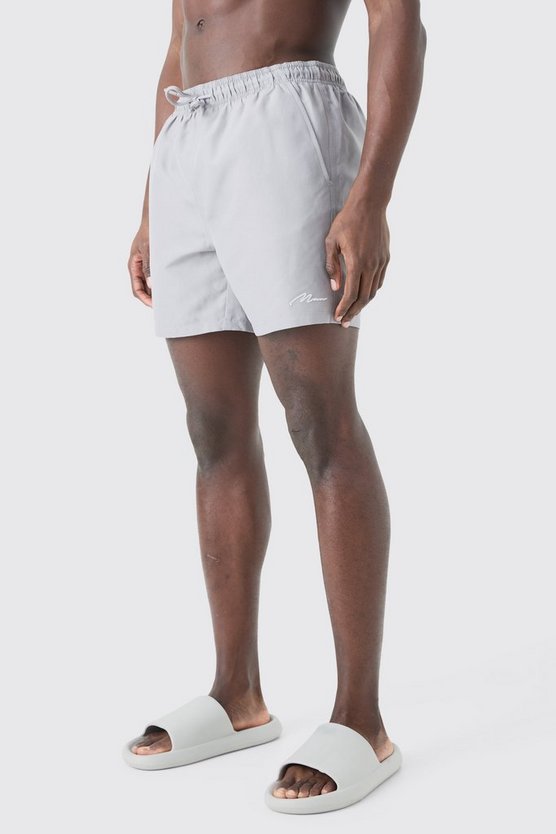 Man Signature mittellange Badehose