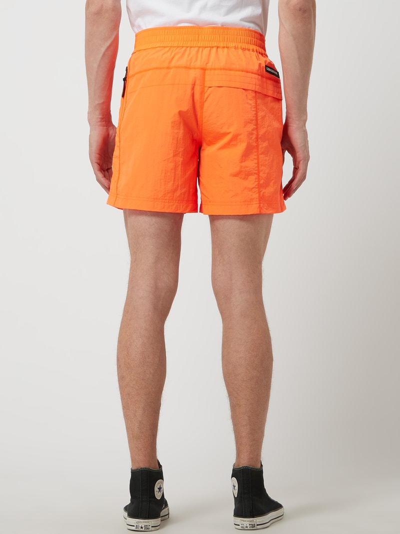 Shorts mit Meshfutter in neon orange