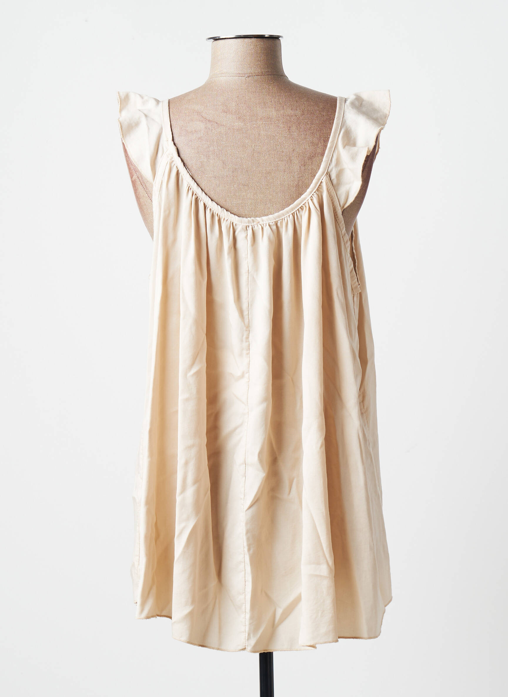 In April 1986 Tuniquemanchecourte Femme couleur beige