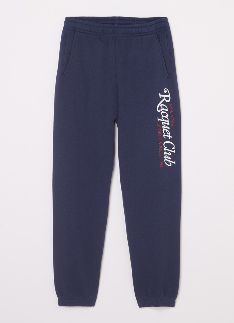 Sporttiset ja rikkaat mailakuvioiset kapenevat collegehousut