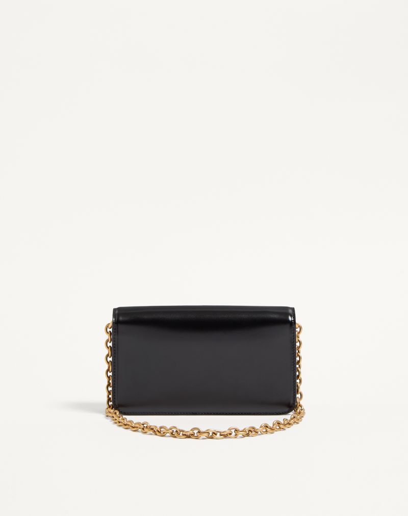Clutch Vain da Valentino Garavani em couro de bezerro brilhante