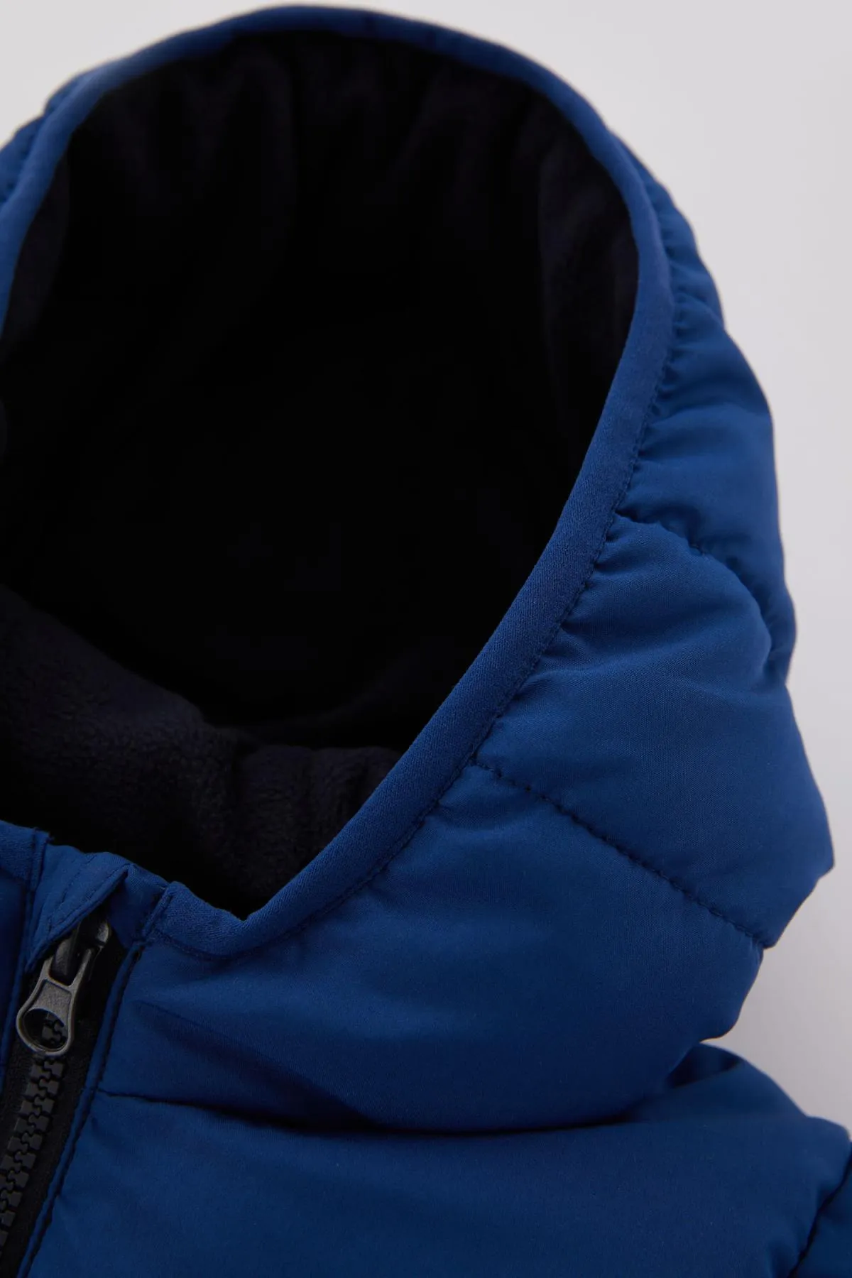 DeFacto  Wasserabweisender, mit Fleece gefütterter Puffermantel für Babys (Jungen).