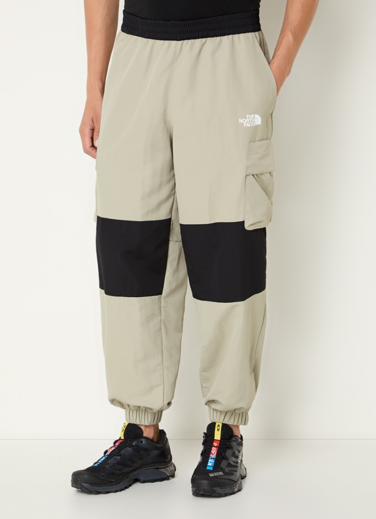 The North Face Tapered fit track pants with flap pockets and logo