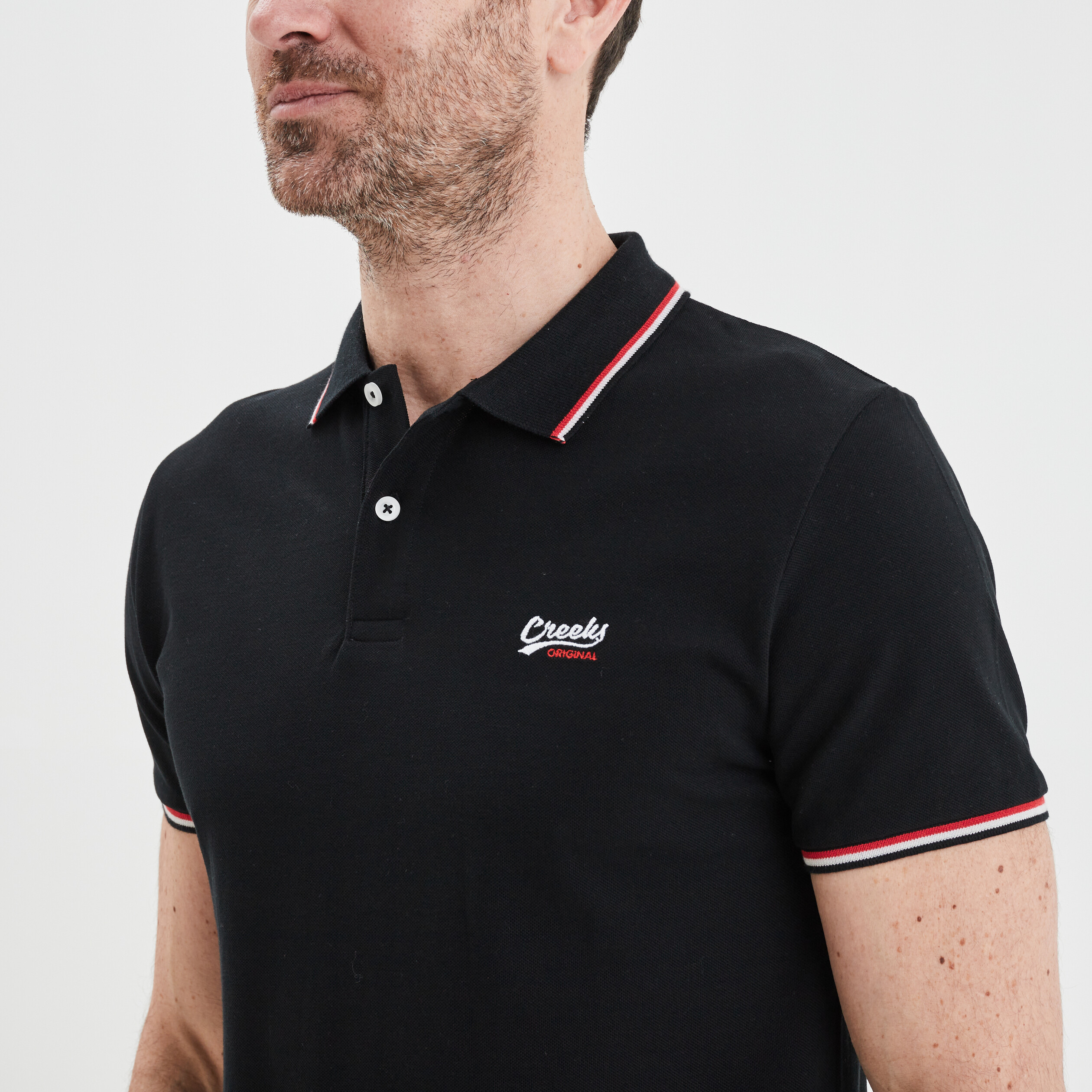 Polo avec broderie poitrine Creeks noir homme | La Halle