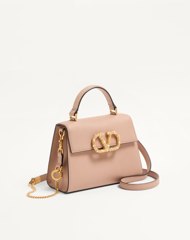 Sac à main Valentino Garavani Vsling petit modèle en cuir de veau grainé avec logo bijou