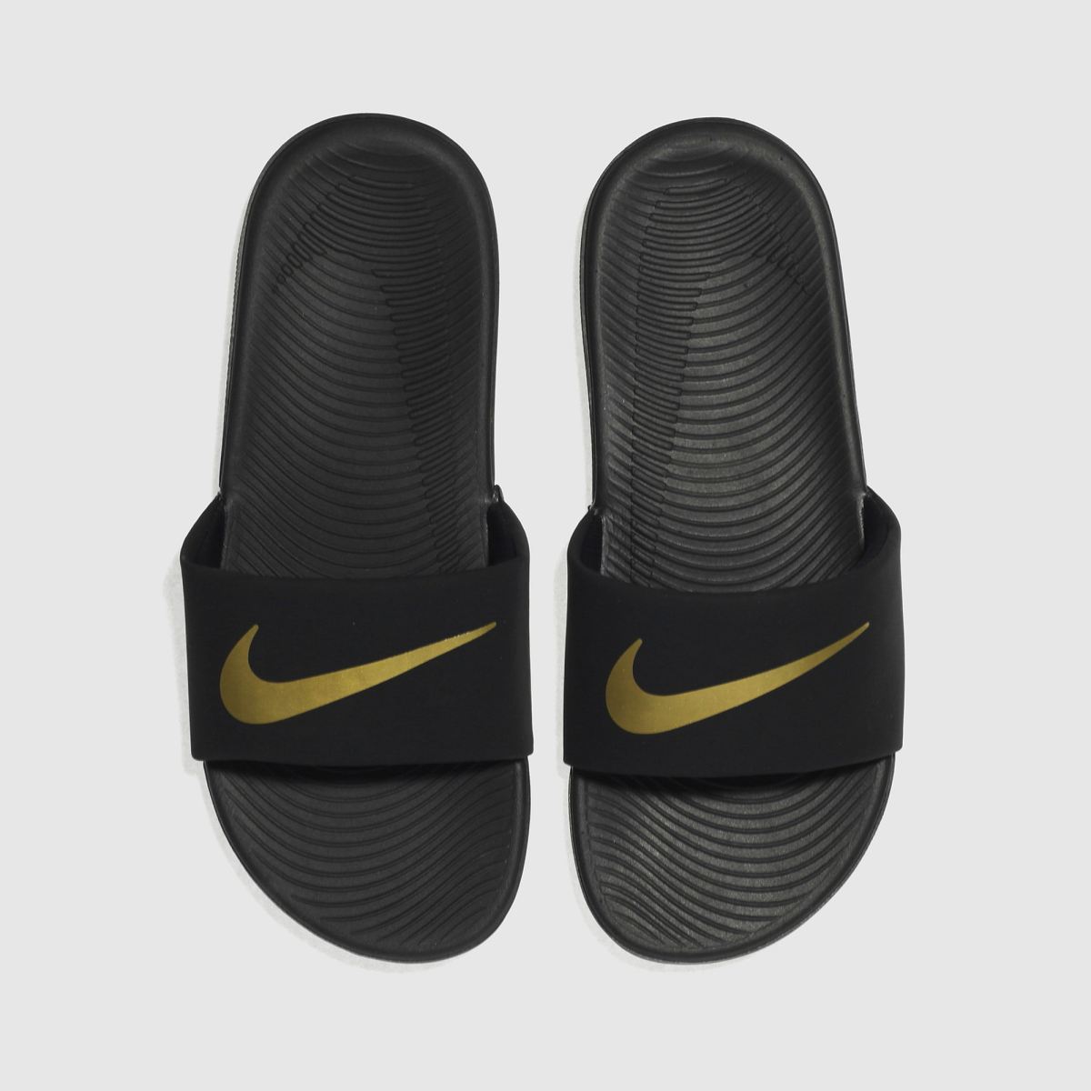Nike svarta och guldfärgade Kawa-sandaler för ungdomar