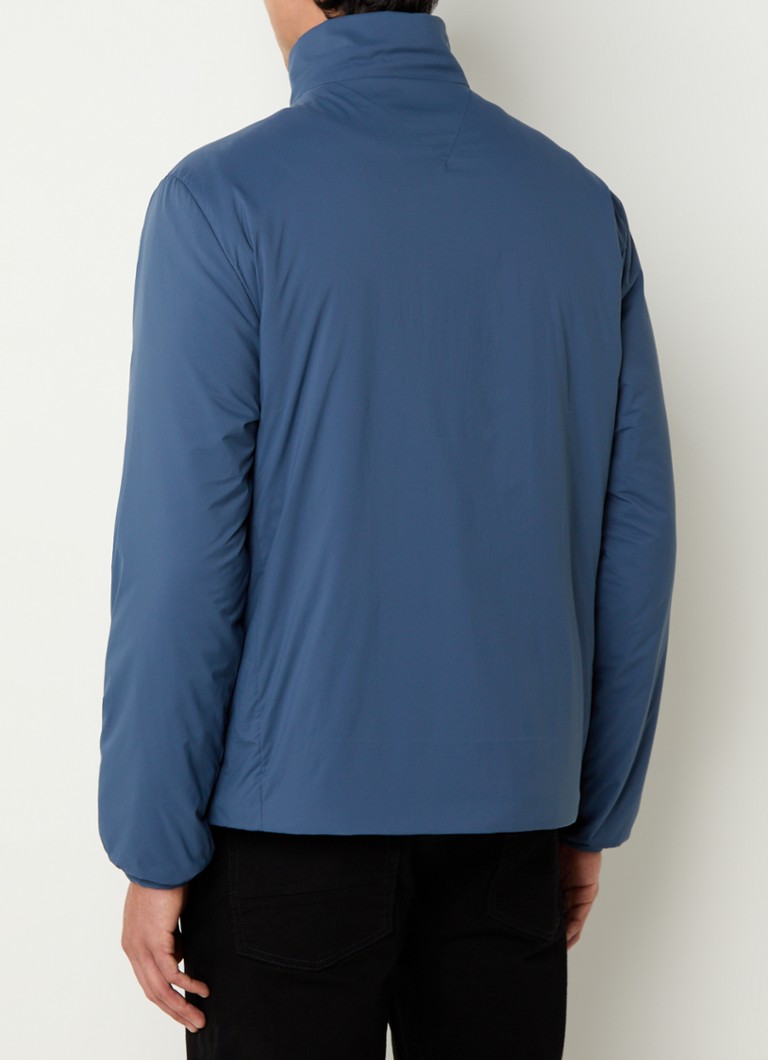 Pršiplášť Tommy Hilfiger s logom a vreckami na zips