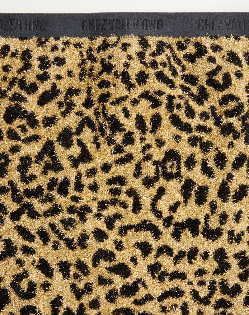 Saia curta em malha jacquard lurex com estampa animal.