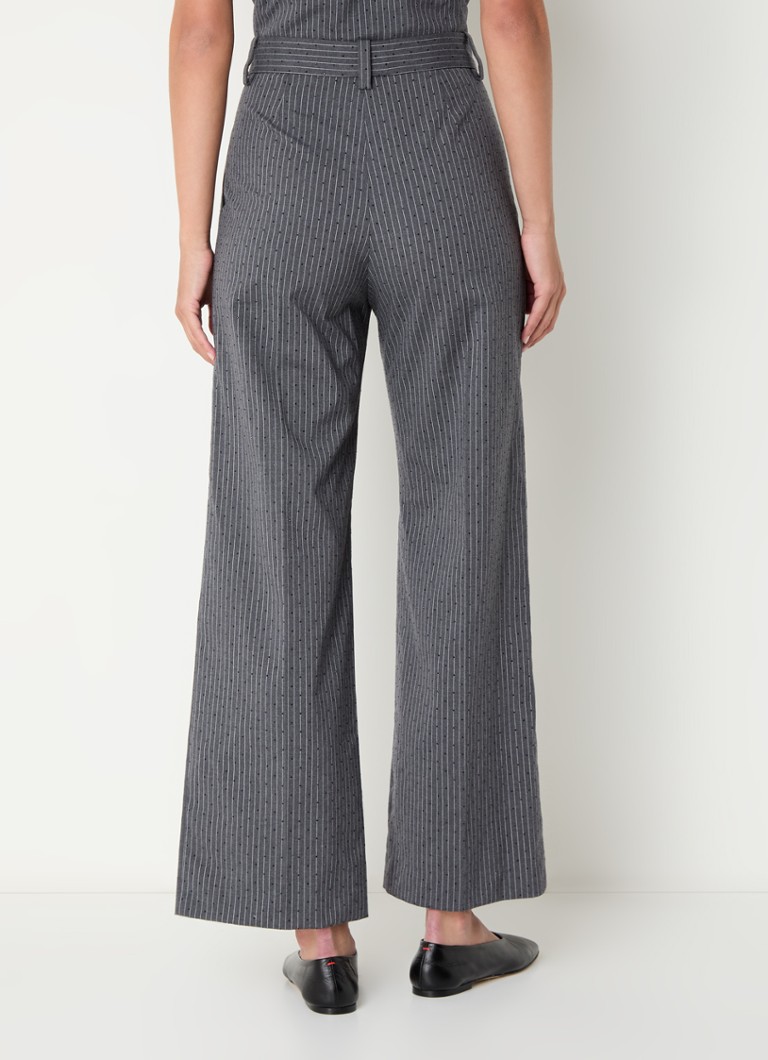 Pantaloni svasati a vita alta di Maje, decorati con sottili righe e strass.