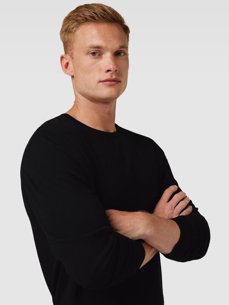 Strickpullover aus Wolle mit Rundhalsausschnitt in schwarz