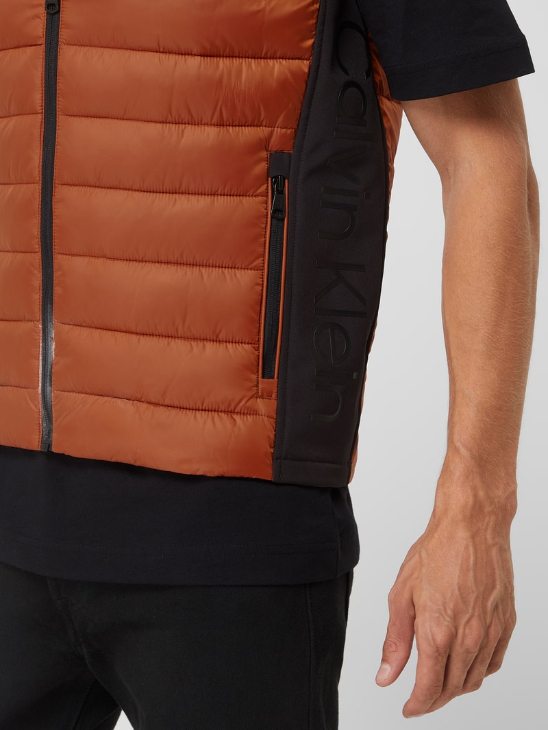 Light-Steppweste mit Stehkragen in dunkel orange