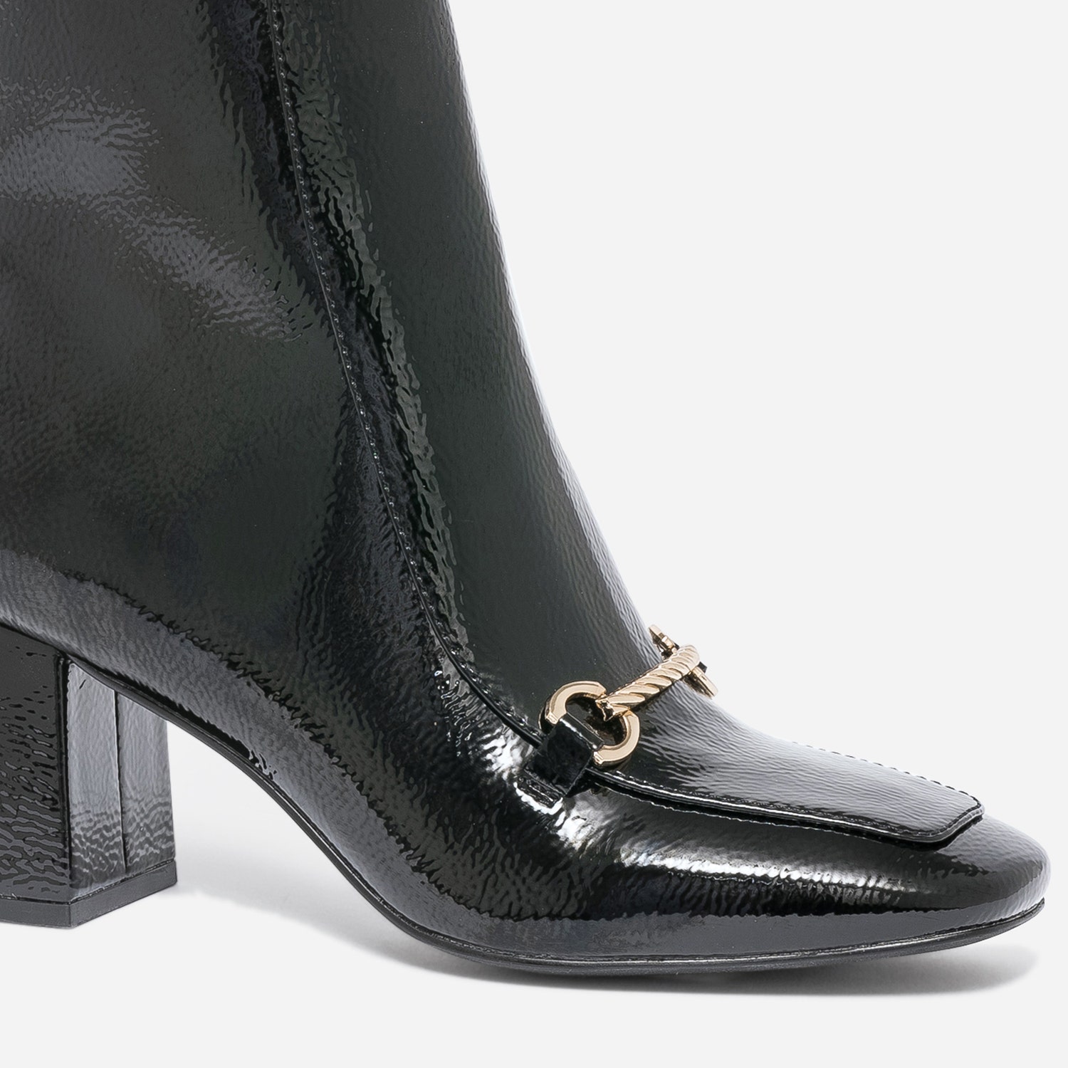 Boots noir verni avec mors doré