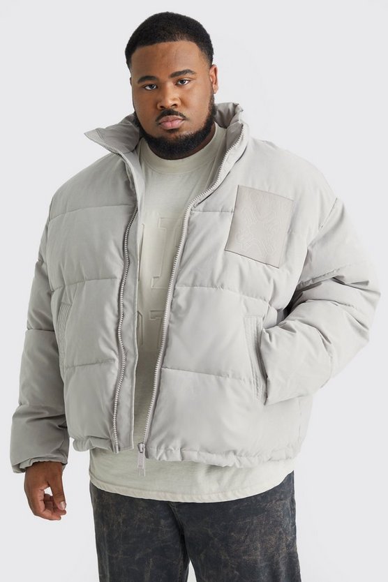 Plus kastige Oversize Nylon-Steppjacke mit PU-Aufnäher