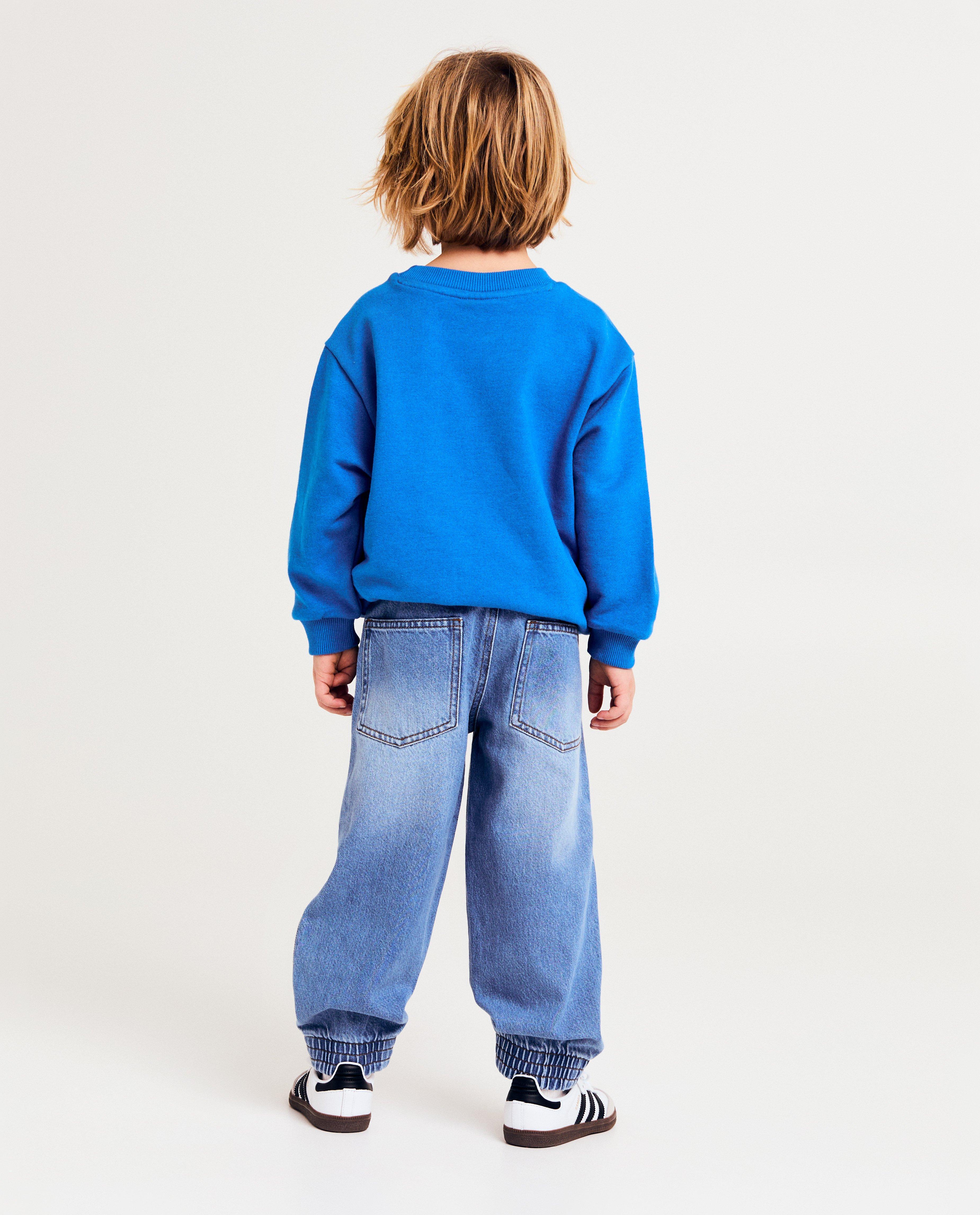 Blugi Kidz Nation cu garnitură, croială baggy, albastru deschis