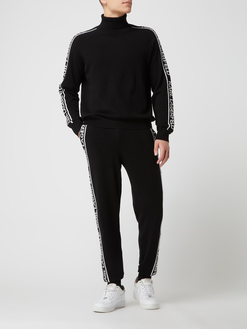 Rollkragenpullover aus Kaschmir in schwarz