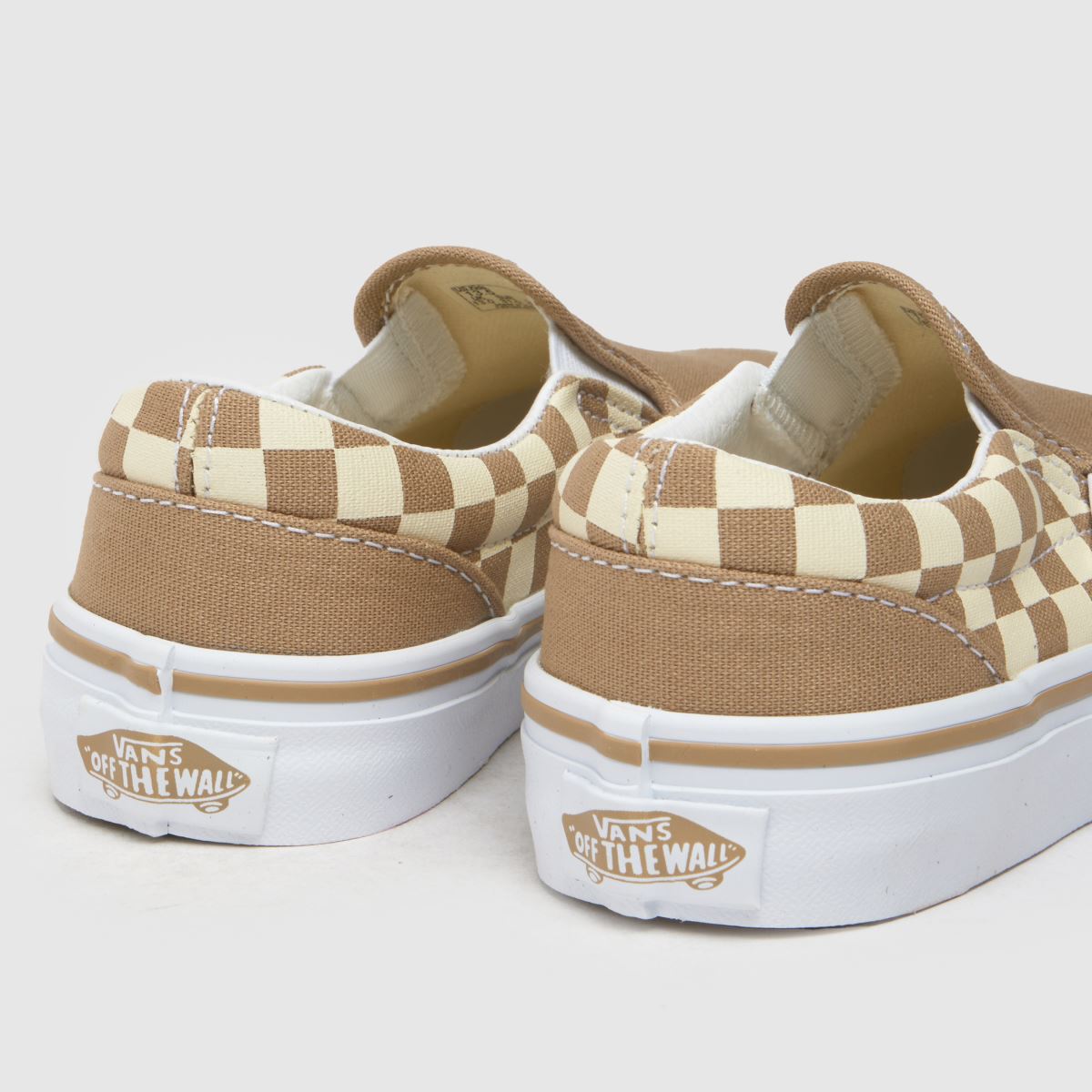 Vans vita och beige klassiska slip-on juniorsneakers