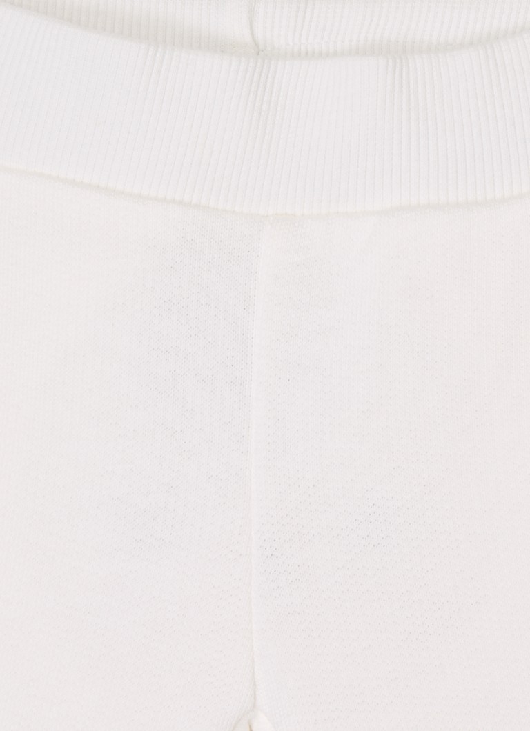 Pantaloni de trening Benetton cu croială conică și broderie.