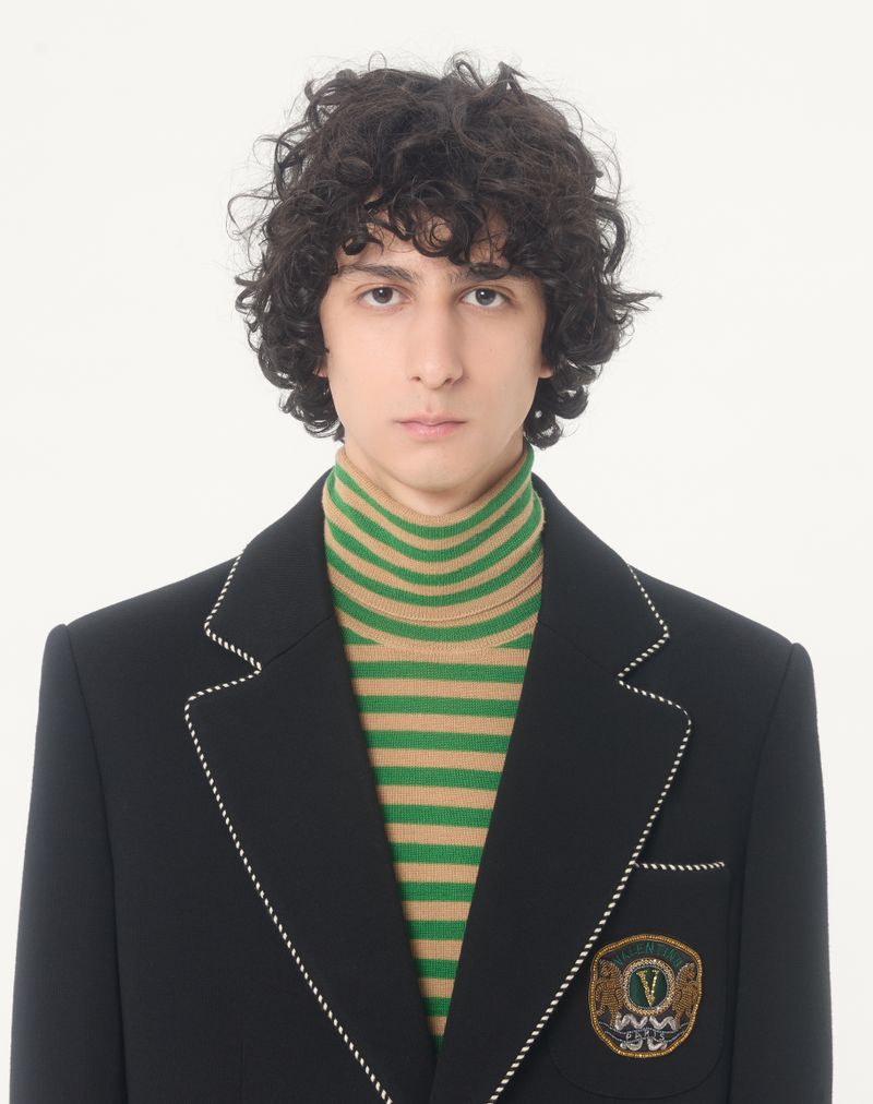 Jaqueta Valentino de lã com abotoamento simples e patch Valentino.