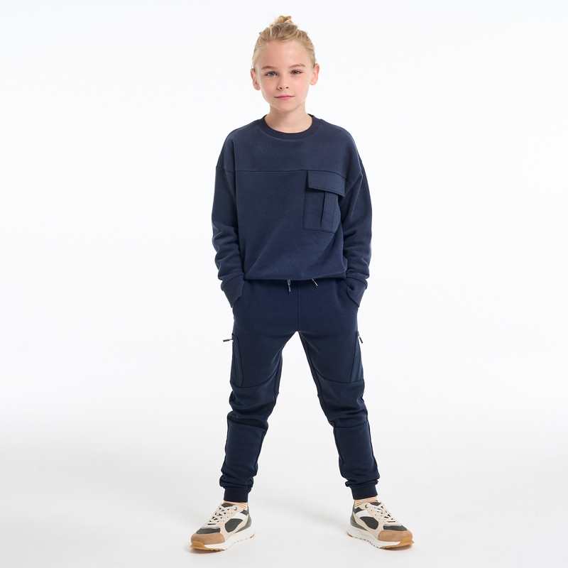 Pantalon de jogging molleton poches zippées bleu garçon