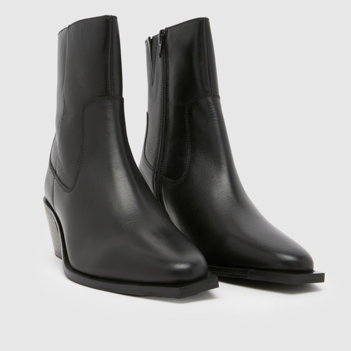 Schuh – Svarta westernstövlar i läder med briar-motiv
