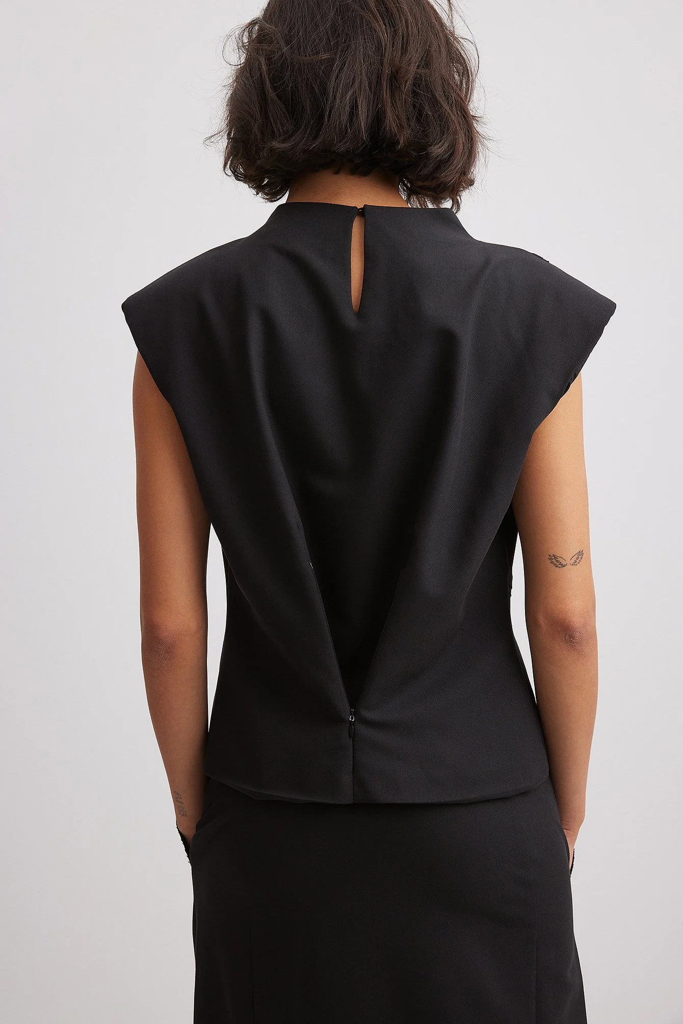 Rohes gewelltes Top