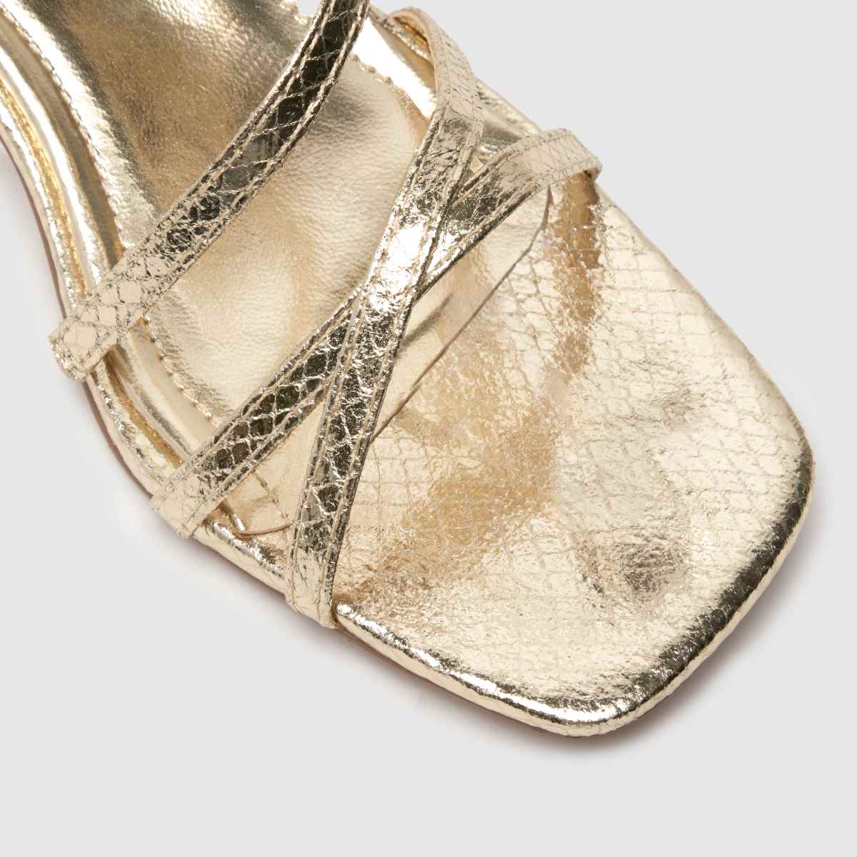Schuh Sander – Guldfärgade sandaler med remmar