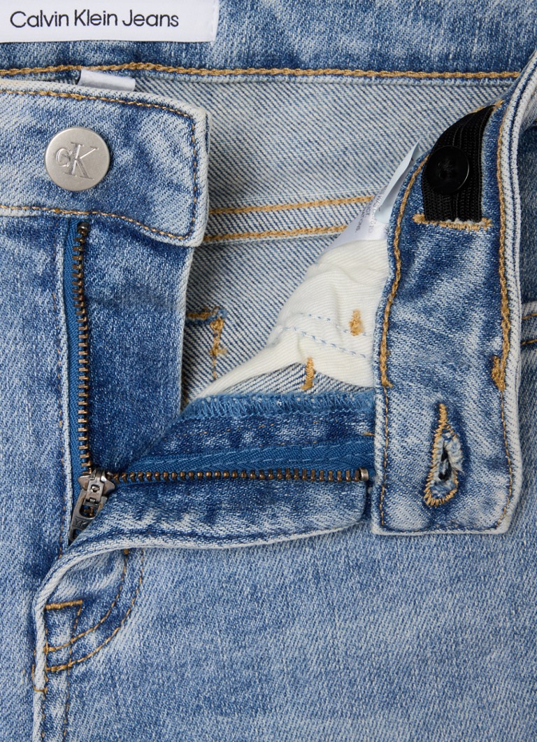 Blugi Calvin Klein cu spălare deschisă la culoare și rupți