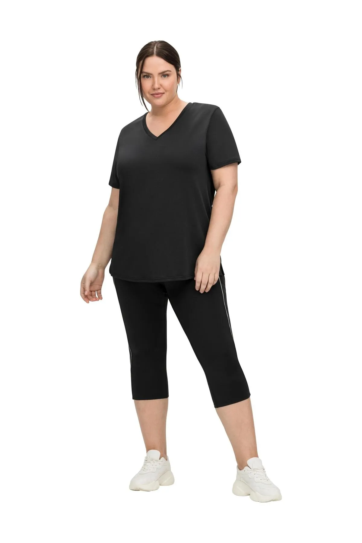 Sheego  Sport-Leggings - Schwarz - Mittlerer Bund