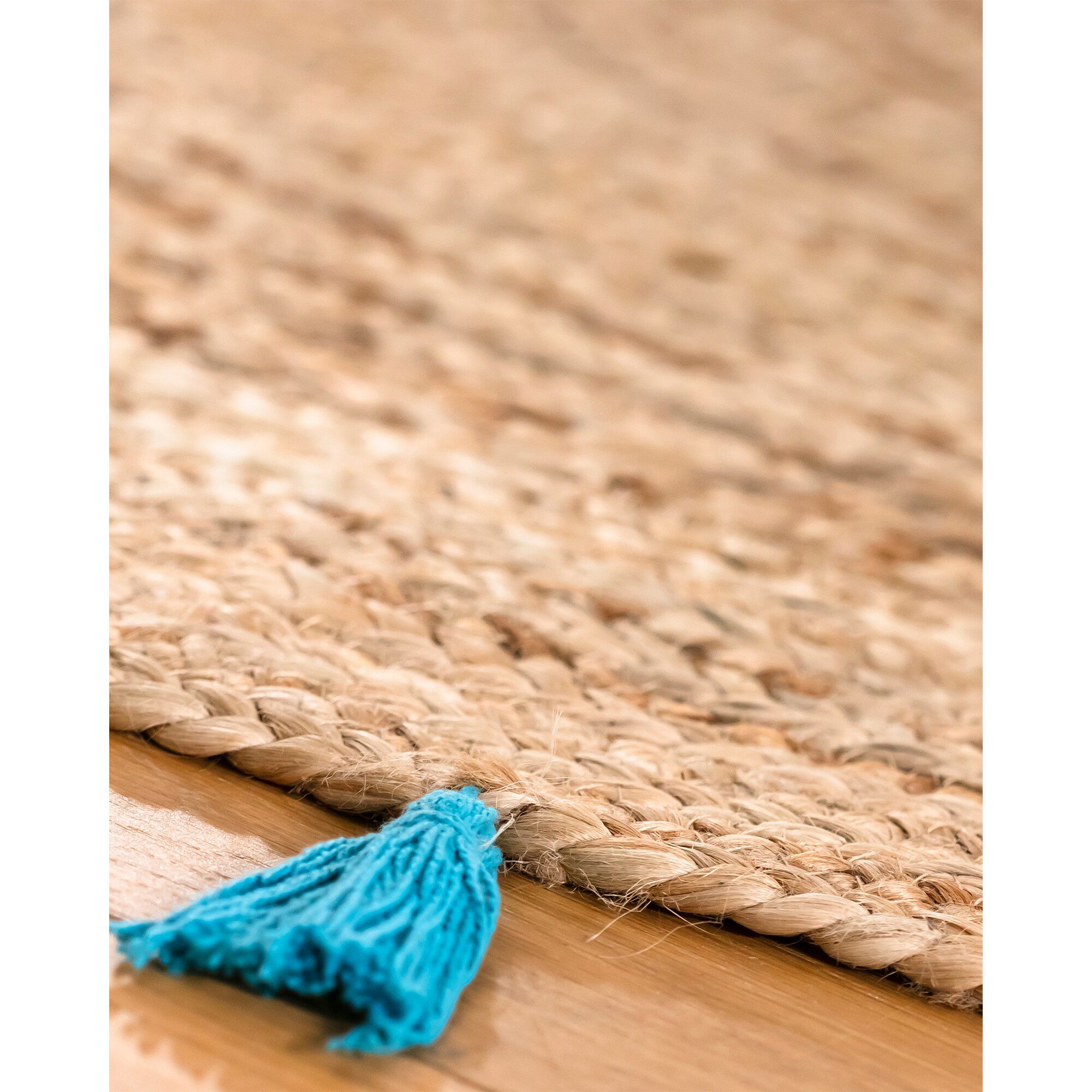 Tapis rond en jute avec pompons de couleur