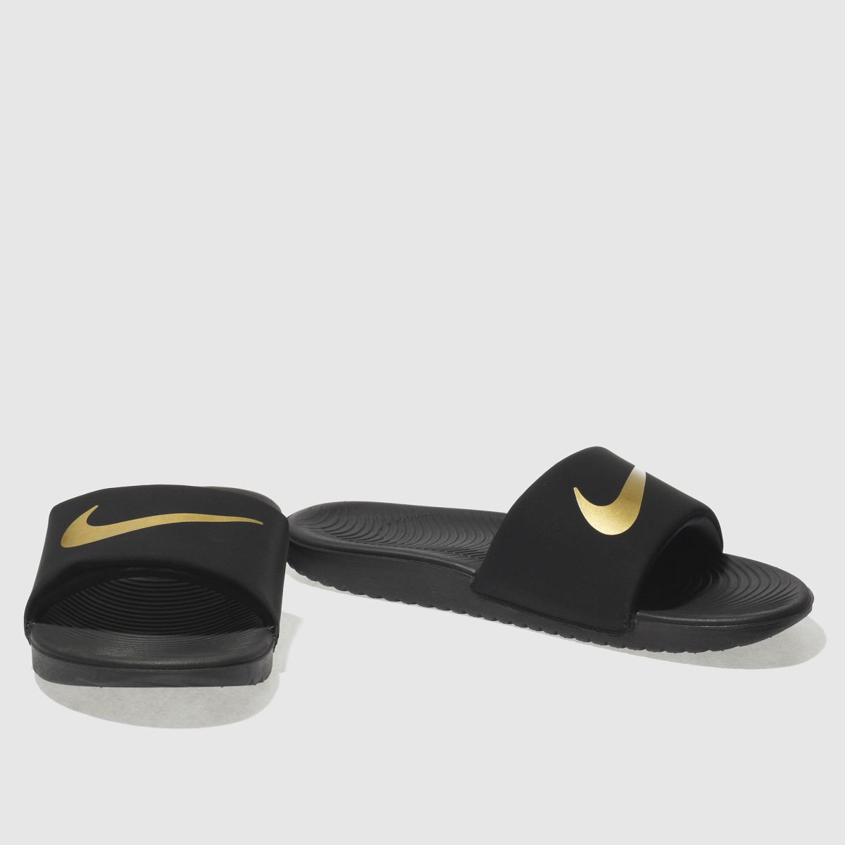 Nike svarta och guldfärgade Kawa-sandaler för ungdomar