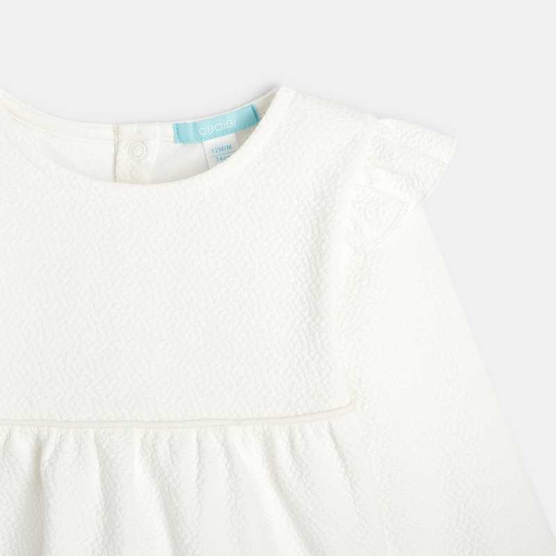Blouse unie tissu gaufré à volants blanche bébé fille
