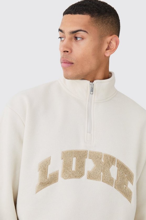 Kastiges Oversize Sweatshirt mit 1/4 Reißverschluss und Borg-Applikation